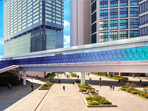 View of skyway bridge with skyscapers in background.