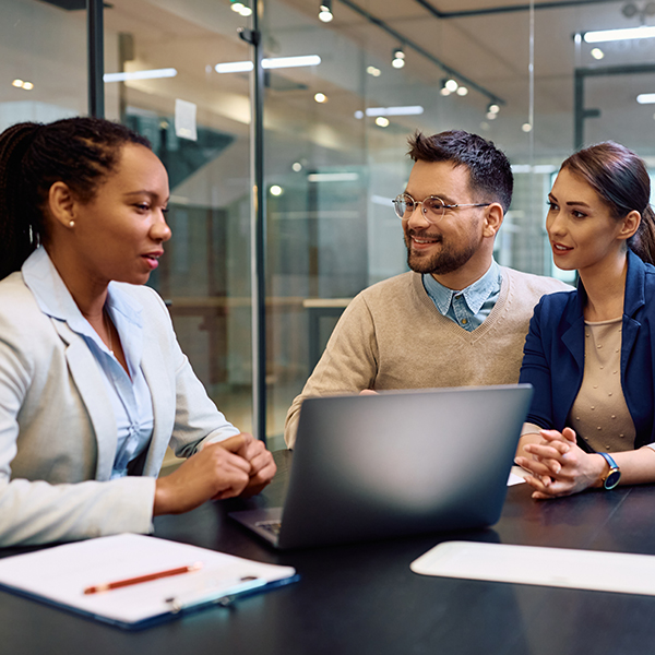 two life healthcare lab technicians looking at a laptop screen 
